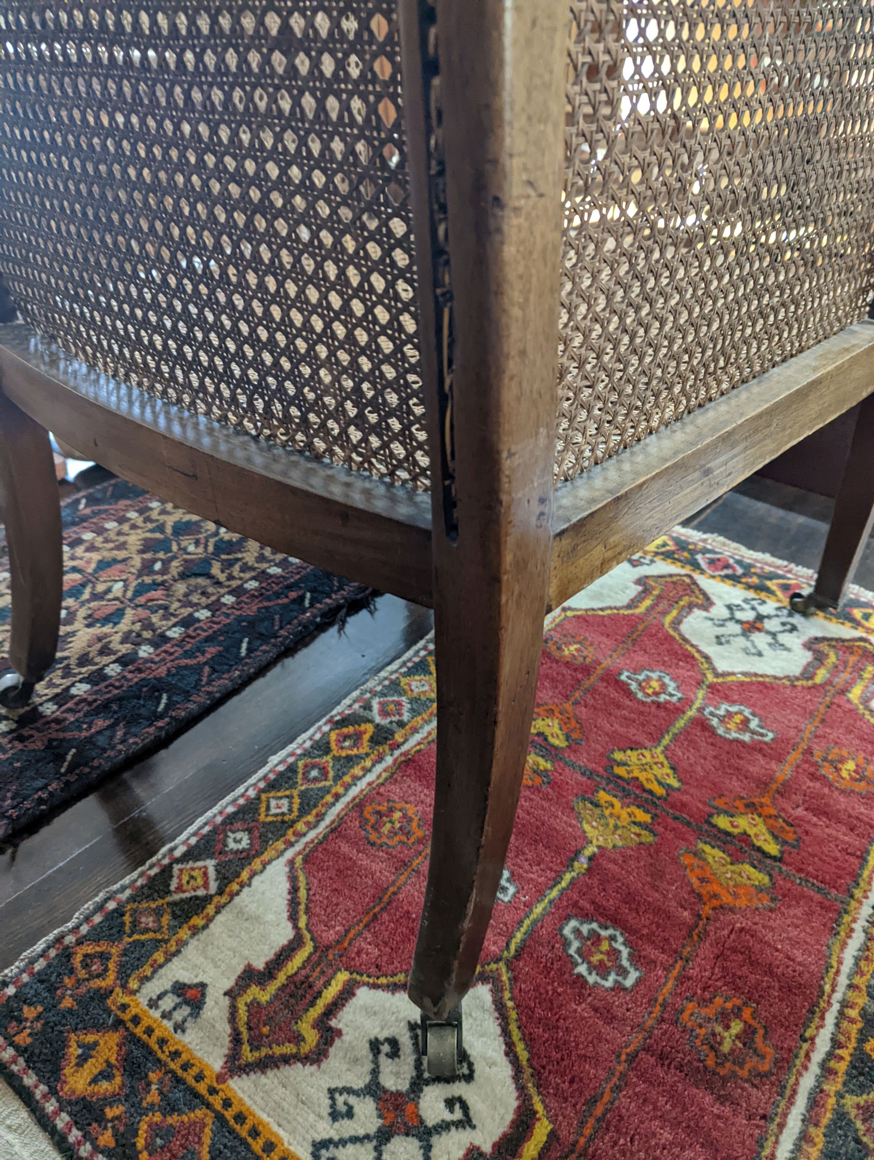 A Regency style mahogany bergere armchair, width 59cm, depth 56cm, height 97cm